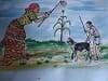 Pictorial logo A family Farm: A woman using a hoe, maize, and a youth with a goat.